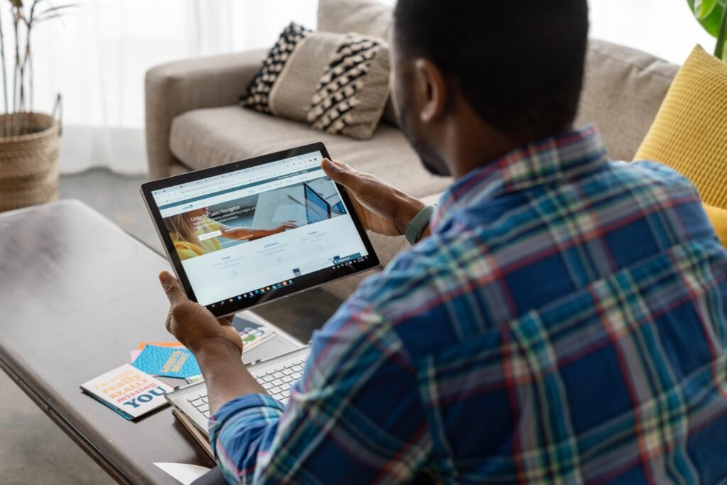 Photo by LinkedIn Sales Navigator: https://www.pexels.com/photo/a-person-in-blue-plaid-long-sleeves-holding-a-tablet-7245798/